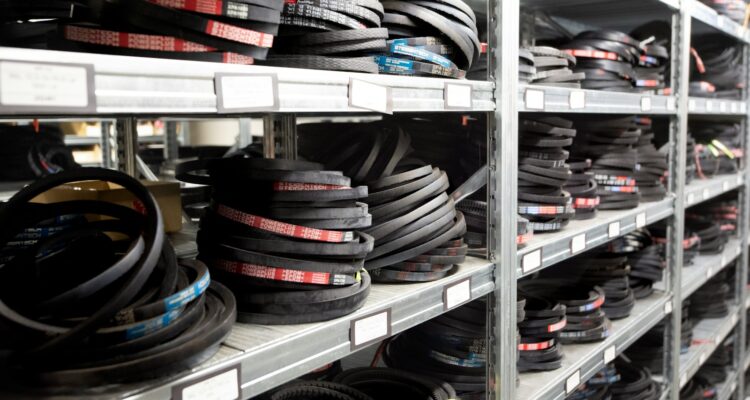 a bunch of tires are stacked on a shelf